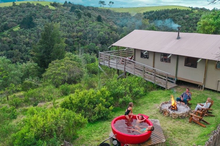 AFRICAMPS---INGWE-(24) family-around-braai-and-hot-tub-at-africamps-ingwe-plettenberg-bay-garden-route