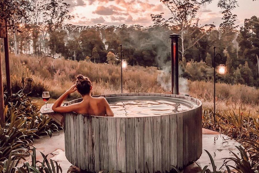 Insta_OH_campsbaygirl_tub_woman_view africamps-oakhurst-wilderness-garden-route-south-africa-glamping-hot-tub
